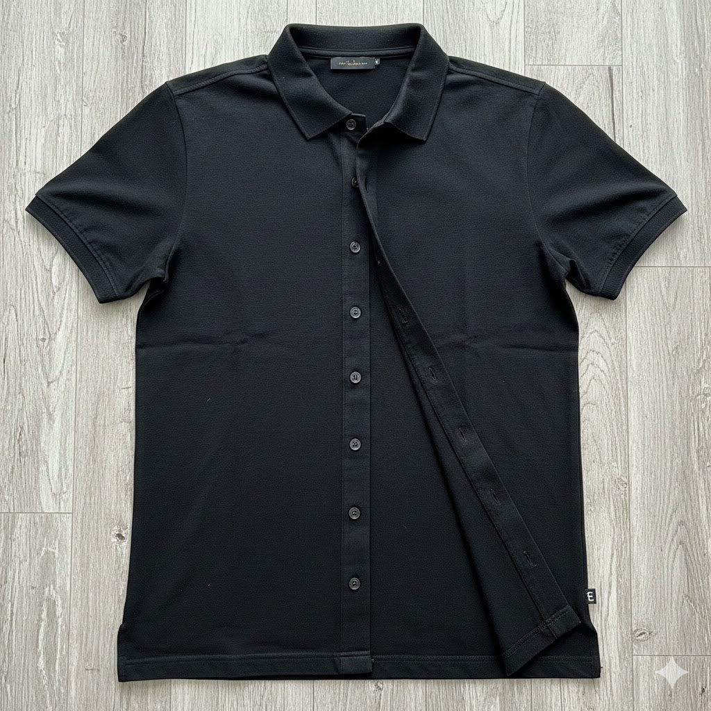 Black short-sleeve shirt on a wooden surface